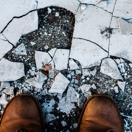 Shoes on withering ground. Photo: Jachan Devol from Unsplash